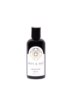 Botella de 120ml del aceite corporal Abundance de Skin & Sky con etiqueta blanca, detalles en dorado.