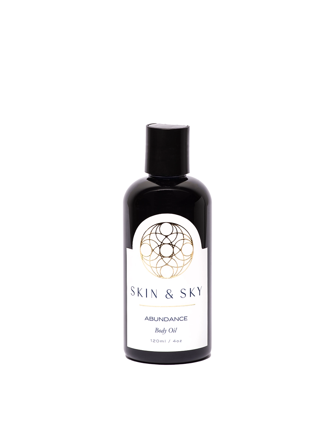 Botella de 120ml del aceite corporal Abundance de Skin & Sky con etiqueta blanca, detalles en dorado.
