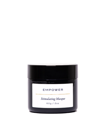 Empower Stimulating Masque en su frasco negro premium de 60 g / 2 oz. Etiqueta minimalista con texto 'Stimulating Masque' en diseño elegante y sofisticado. Mascarilla potente con pH 4 para revitalizar, oxigenar y renovar todo tipo de piel.