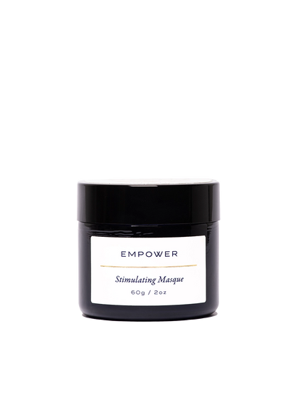 Empower Stimulating Masque en su frasco negro premium de 60 g / 2 oz. Etiqueta minimalista con texto 'Stimulating Masque' en diseño elegante y sofisticado. Mascarilla potente con pH 4 para revitalizar, oxigenar y renovar todo tipo de piel.