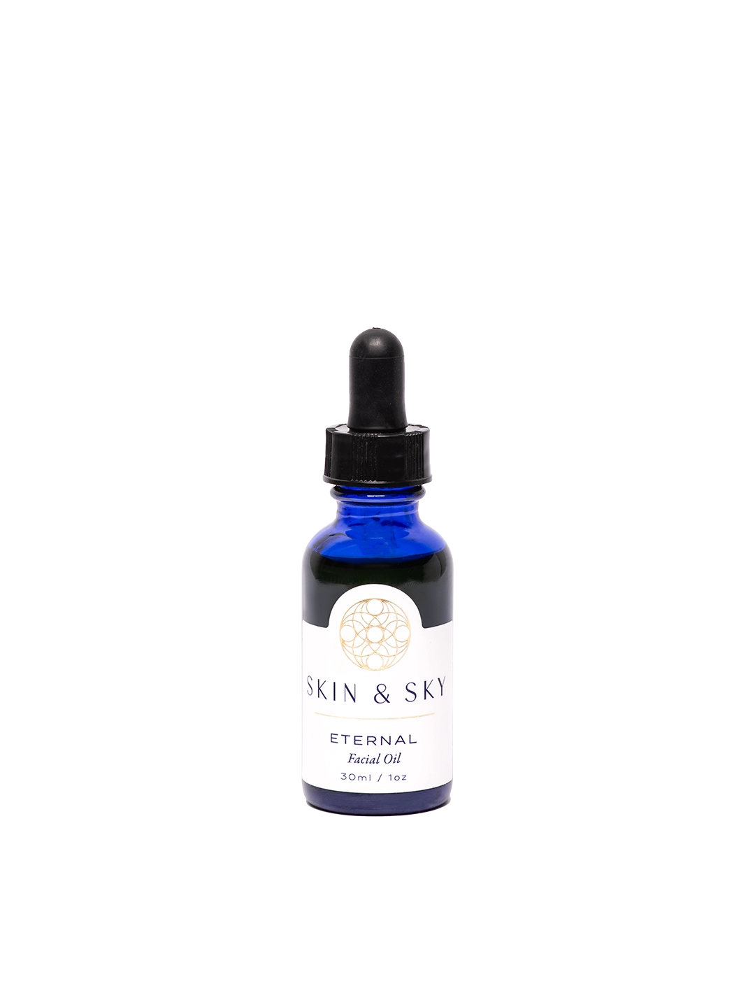 Frasco premium azul de Eternal Facial Oil de Skin & Sky, con gotero negro y etiqueta minimalista en tonos oro y blanco que dice 'Eternal Facial Oil'. Aceite antioxidante de 30 ml / 1 oz que ilumina, hidrata y rejuvenece la piel con ingredientes naturales como semilla de granada y hemp.