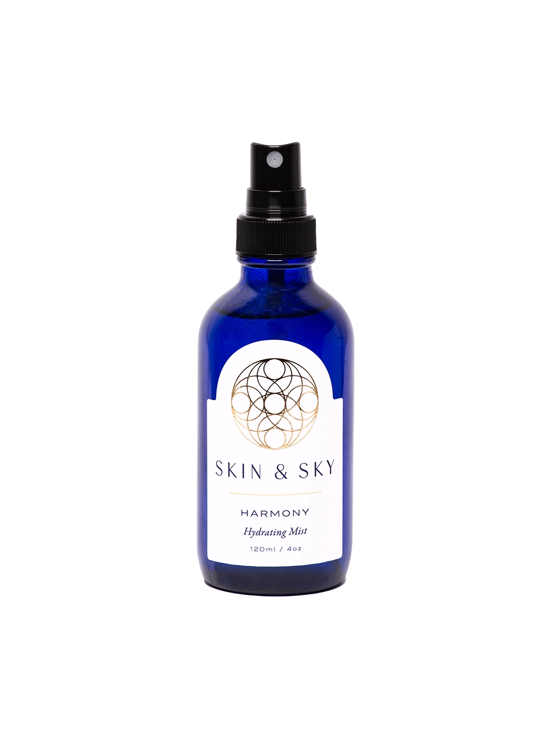 Frasco azul con atomizador negro y etiqueta blanca, bruma facial hidratante y calmante para piel normal, seca y sensible, 120 ml.